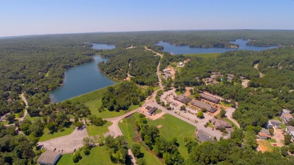 Aerial shot of Cherokee Village Town Center with Lake Cherokee, Lake Thunderbird and Lake Sequoyah in the background.